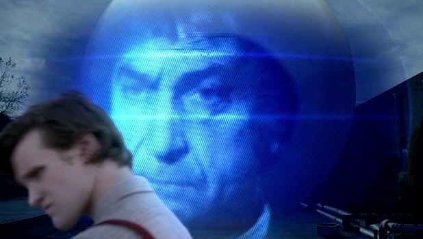 The Eleventh Doctor in front of an image of the Second Doctor.